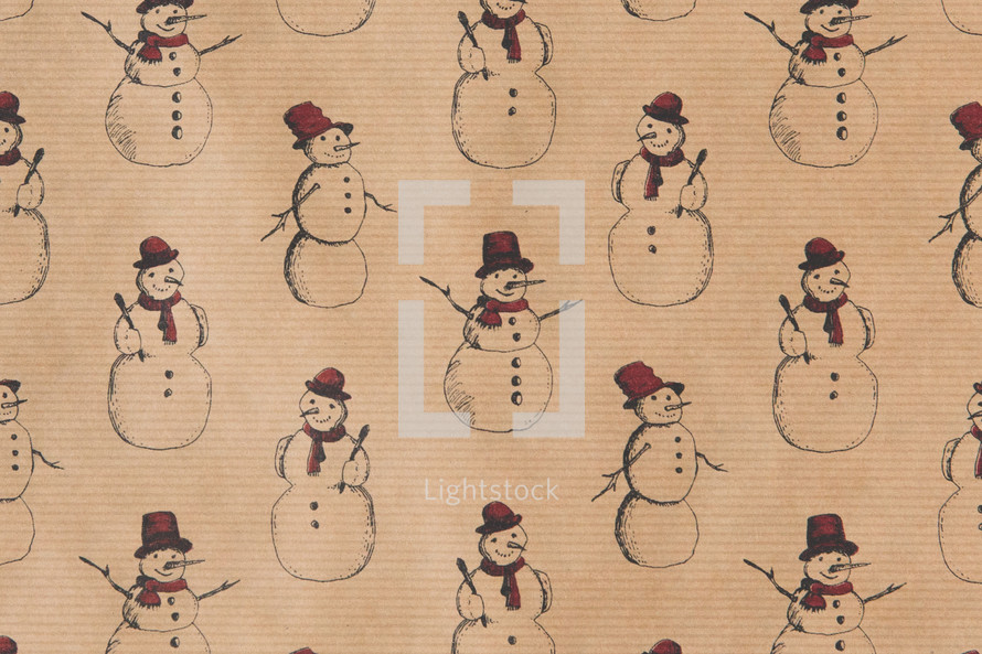 snowman pattern on brown paper 