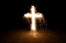 shape of a cross out of dripping lights 