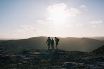 friends standing on a mountaintop in New Zealand 