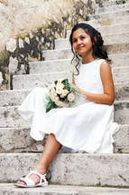 girl in a white dress for her first communion 