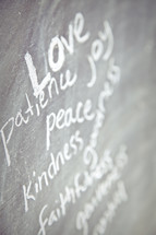 The Fruit of the Spirit - love, patience, kindness, faithfulness, peace, joy, and gentleness written on a chalkboard