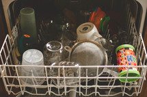 dishwasher full of dirty dishes 