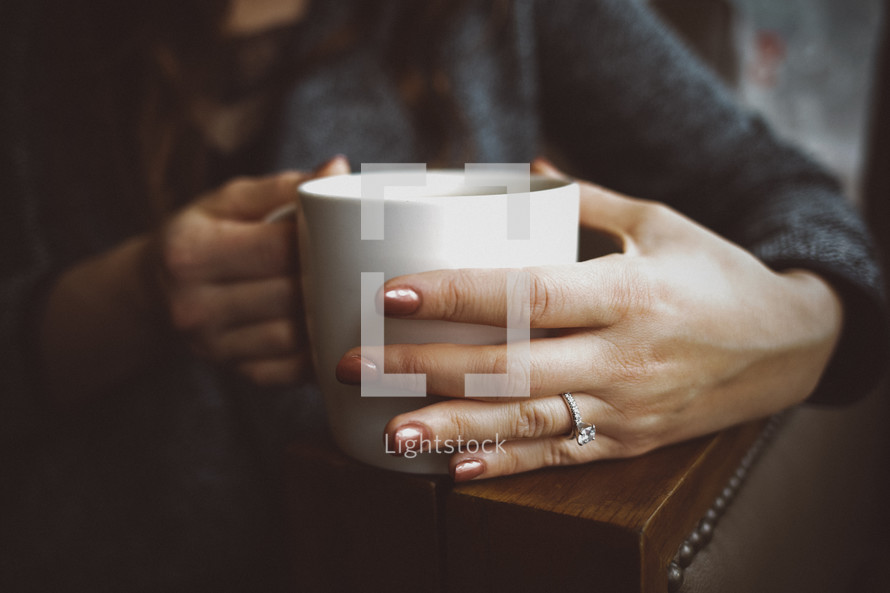 a woman drinking coffee 
