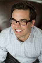 smiling man in glasses