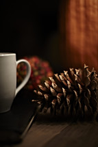 pine cone and coffee mug