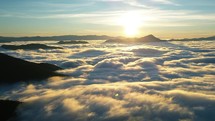 Magic sunrise above foggy clouds in wild alpine nature landscape in spring morning hyper time lapse