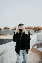 a man taking a picture with his camera 