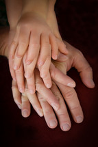 Closeup of families hands