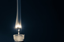 broken light bulb glowing