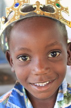 boy child wearing a crown