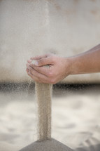 filtering sand through your hands