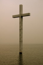 cross rising out of water