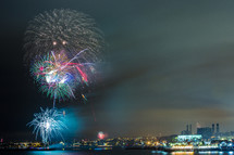 fireworks bursting over a city