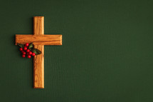 olive wood cross and red berries 