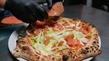 Pizza Chef Adding Tomatoes And Salad