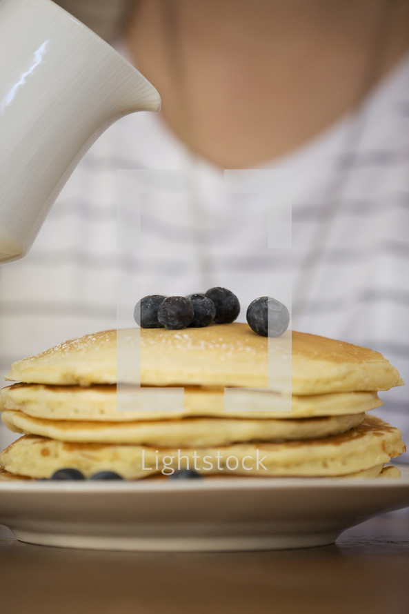 stack of pancakes and blueberries 