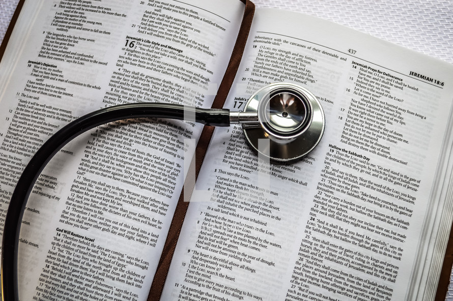 stethoscope on the pages of Bible 