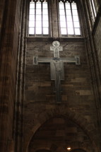 crucifix on a stone wall 