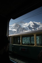 cable car and snowy mountain peaks 