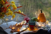 Autumn Decor with Flowers, Open Book and Cup Of Tea