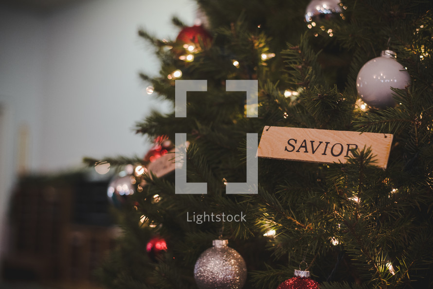 savior ornament on a Christmas tree 