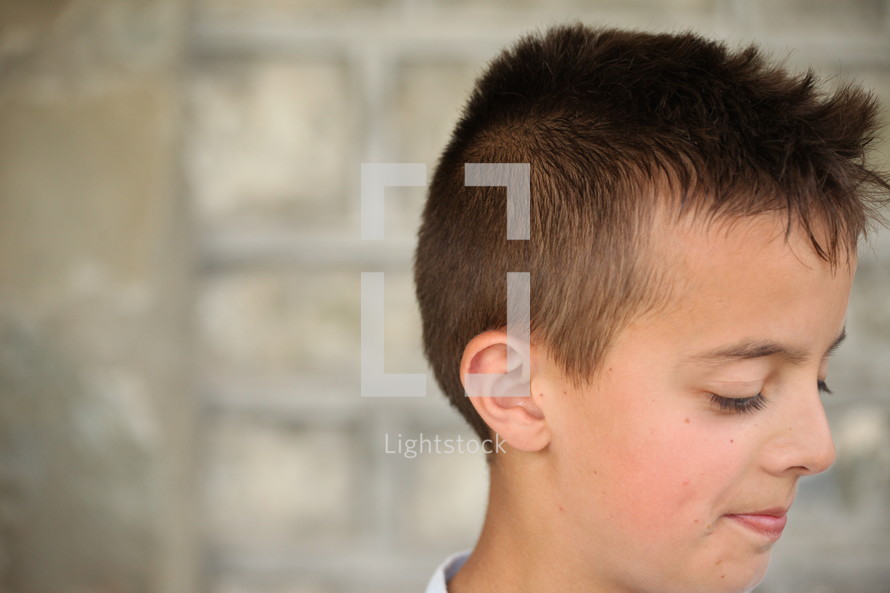 side profile of the face of a young boy 