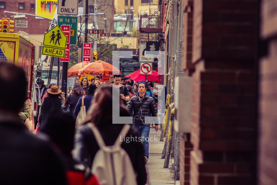 pedestrians on a busy city sidewalk 