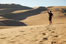a man exploring a desert 