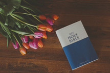 Bible and tulips on a desk 