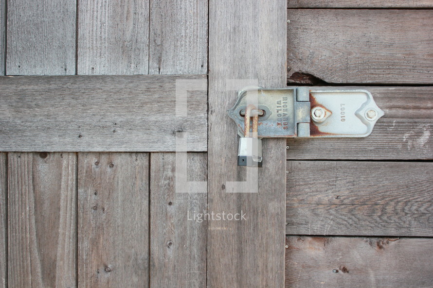 padlock on a wooden door 