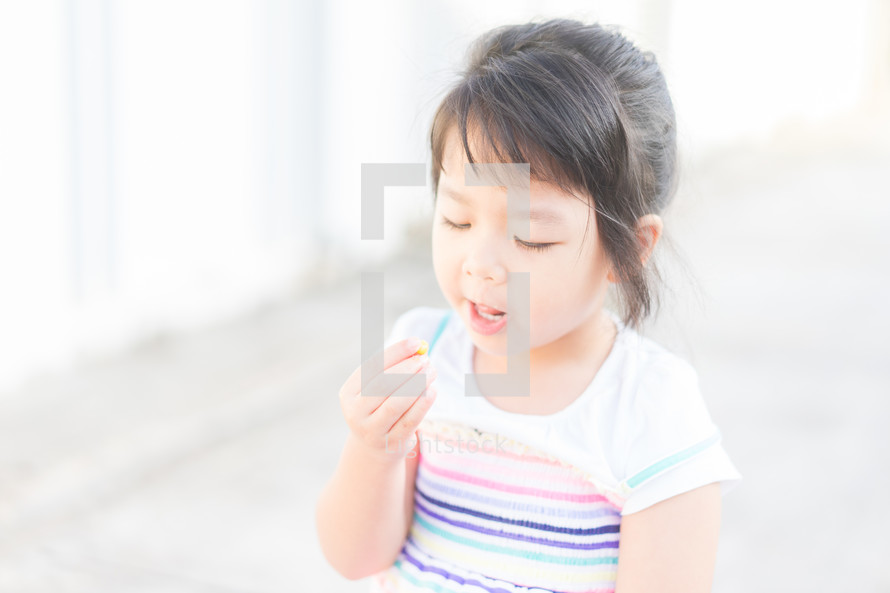 a child eating a snack 