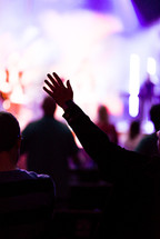raised hands at a contemporary worship service 