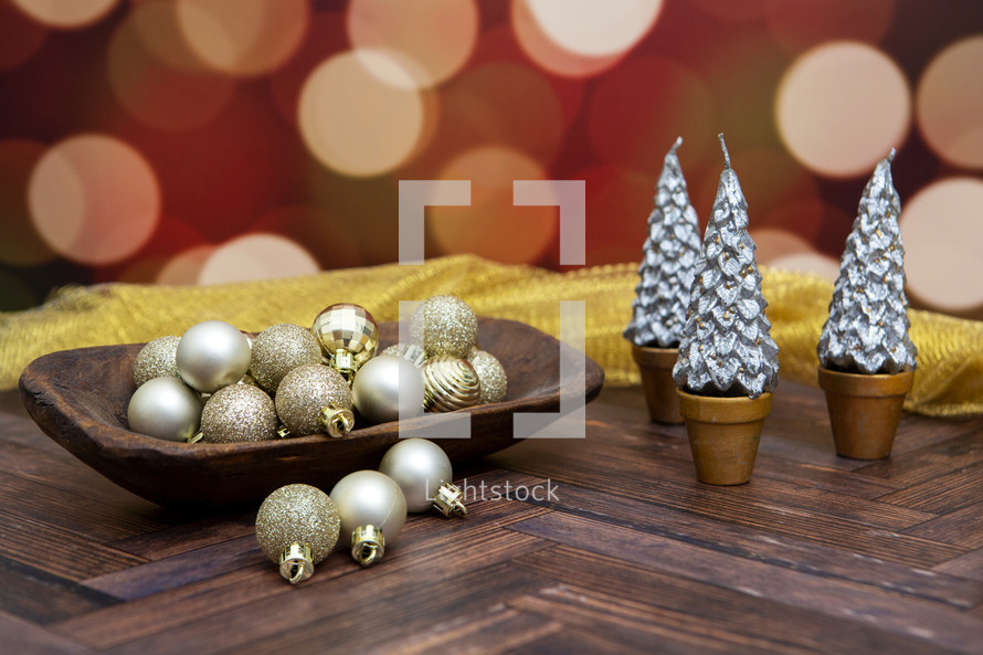 Small gold and silver Christmas decorations with bokeh background
