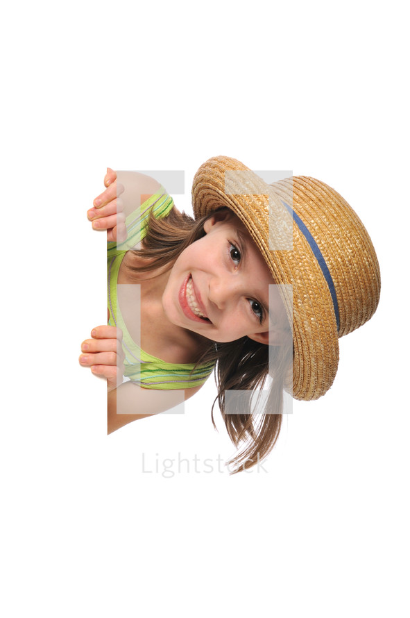 little girl wearing an Easter bonnet holding a sign 
