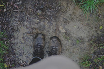 boots standing in mud 