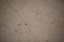 Dirty cement floor.