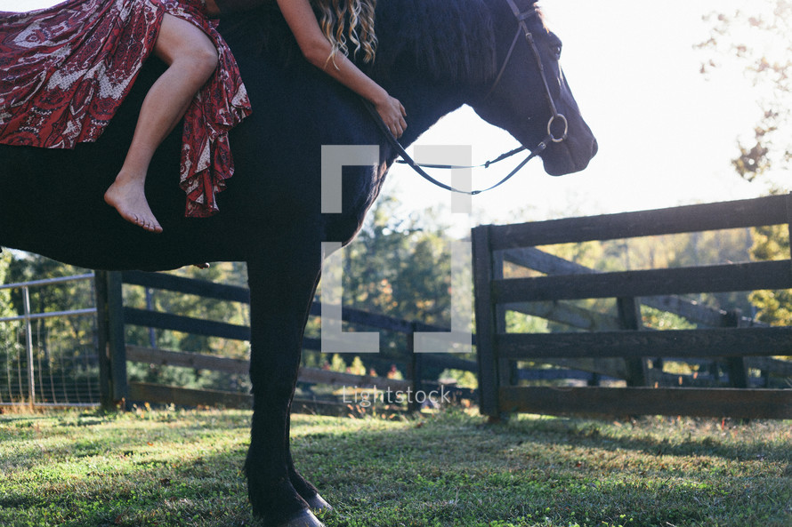 a woman riding a horse 