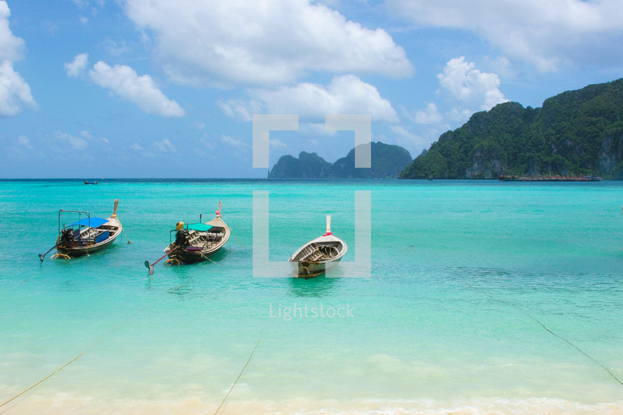 boats on turquoise water 