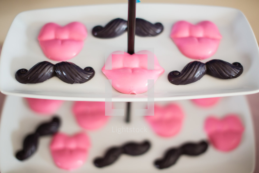 Candy lips and mustaches.