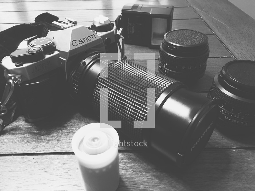 camera, lenses, and film canister 