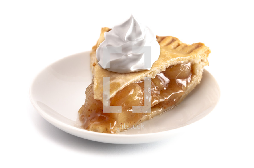whip cream on a slice of apple pie 