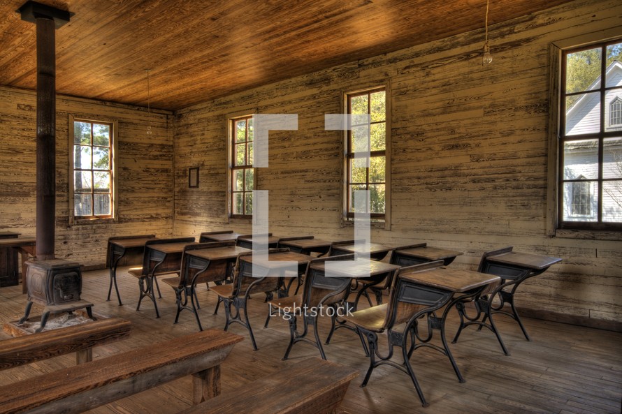 an old school house classroom and desks 