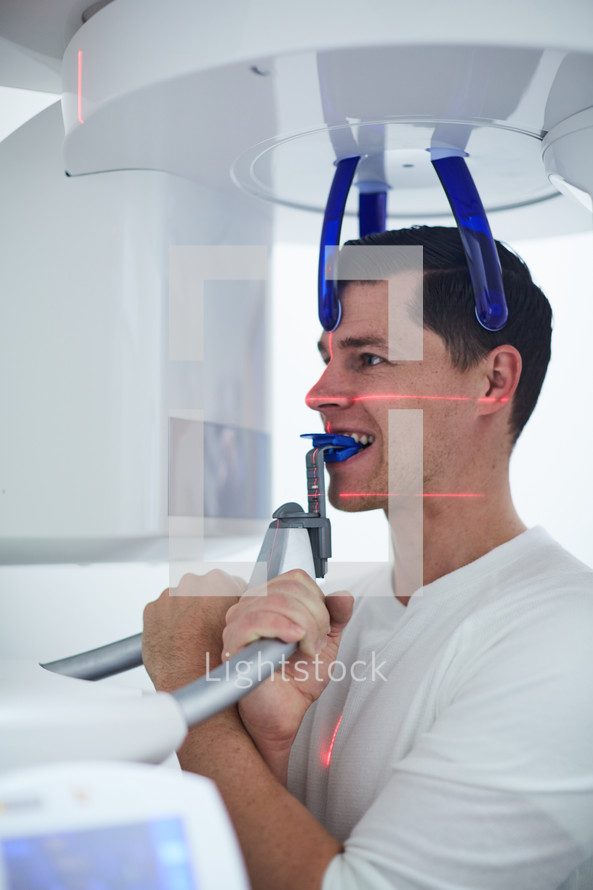 a man getting x-rays at the dentist