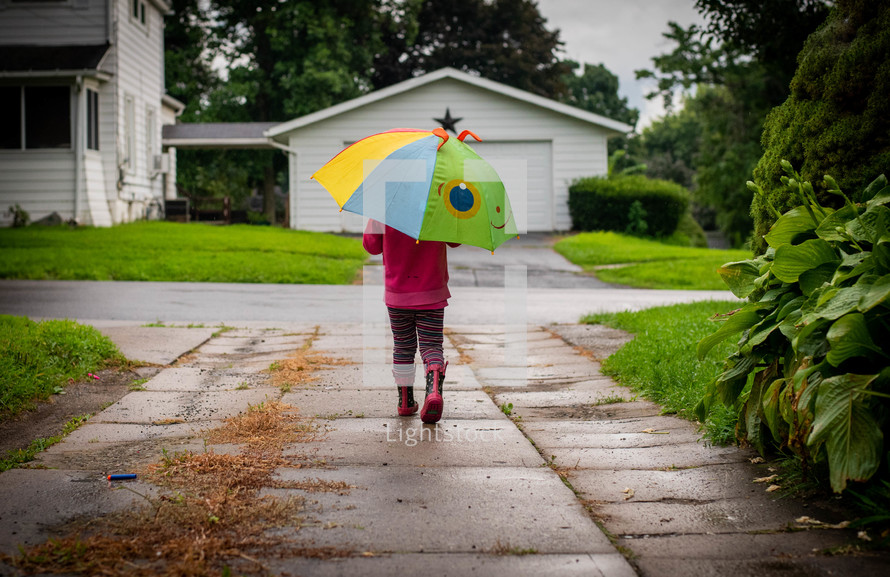 toddler with an umbrella 