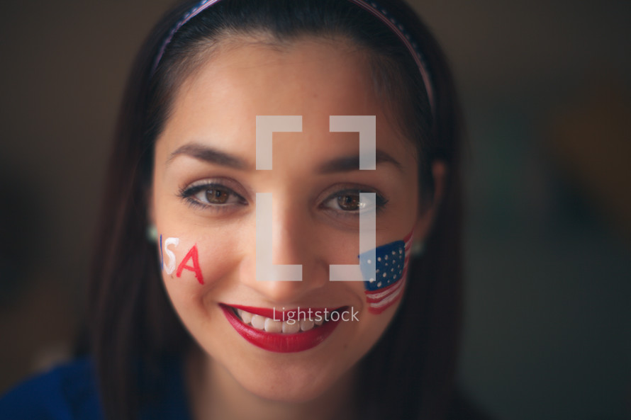 woman with a painted face for July 4th 