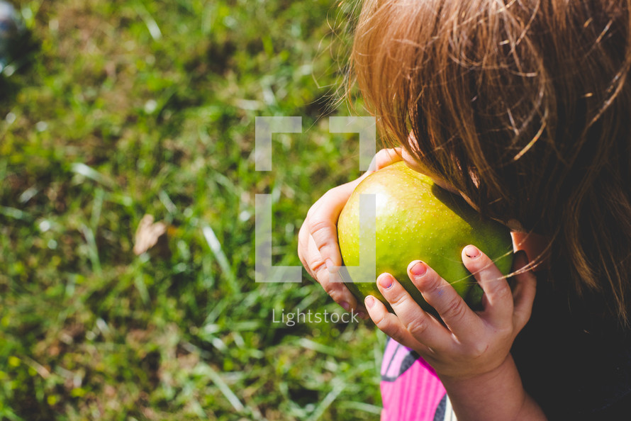 girl eating an apple 
