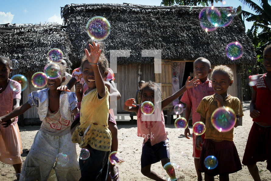 children playing with bubbles 