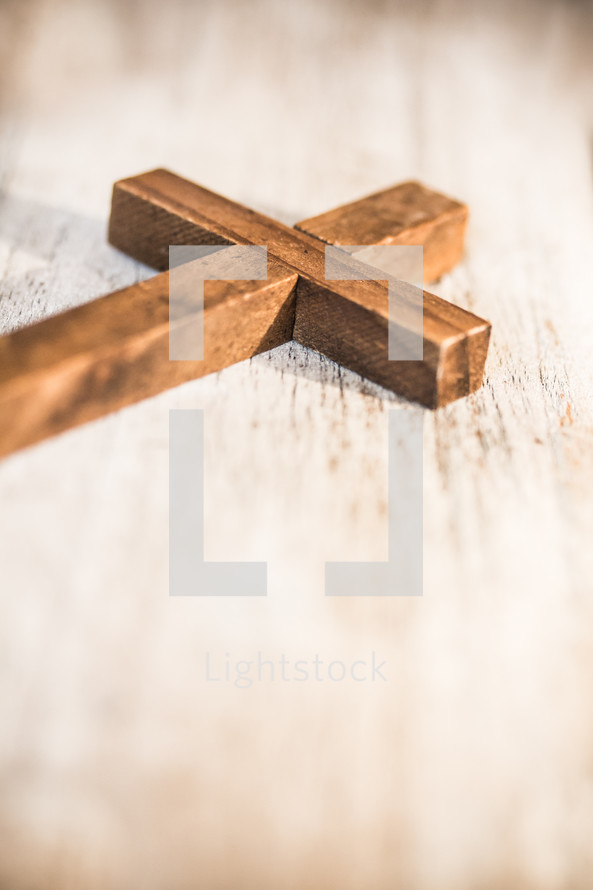 wooden cross on white wood 