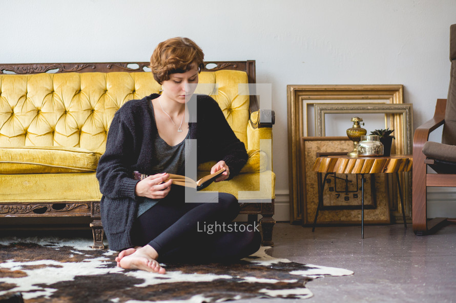 a woman sitting and reading 