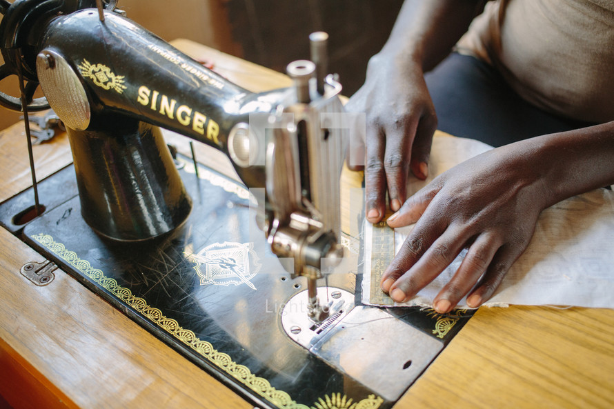 woman using a sewing machine 